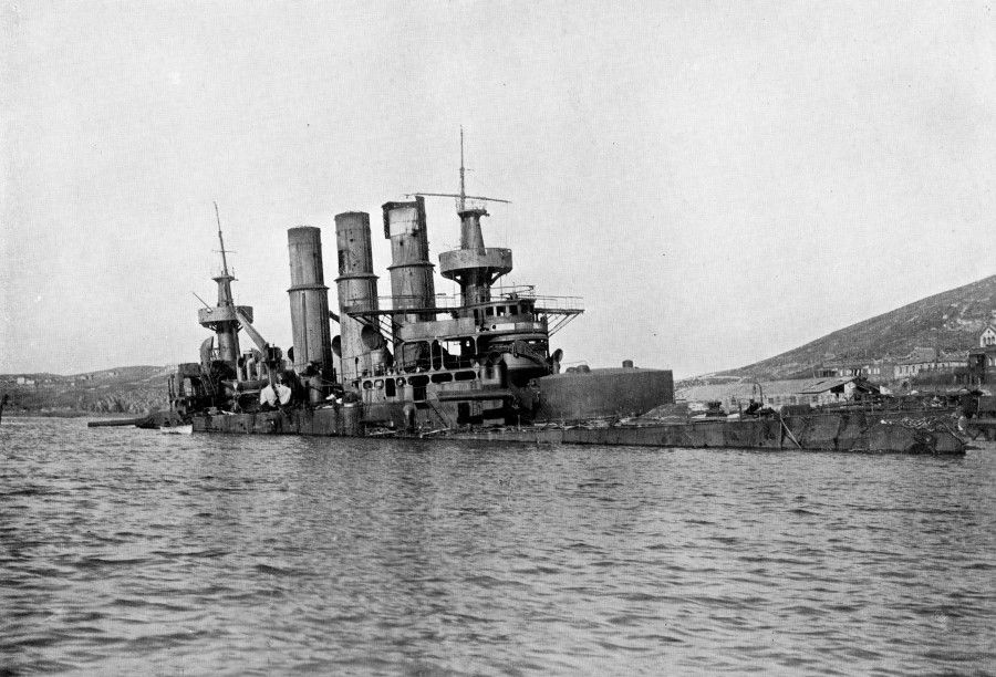 A stranded Russian cruiser destroyed at Port Arthur, 1904. On 2 September, under a sudden attack by Japanese troops, Russian ships left Port Arthur and fought Japanese ships at Liaodong Bay. The Russian ships were beaten back to Port Arthur, and Admiral Tōgō Heihachirō arranged sunken ships at the passage and planted a vast area of sea mines, locking the Russian fleet in Port Arthur. On 18 April, Tōgō led a Japanese fleet towards Port Arthur, seemingly to attack the Russians, but in fact to lure the Russians into the mine area. Russian admiral Stepan Makarov failed to see the trap and led a fleet against the enemy, only to have his flagship sunk by mines and Makarov along with it. The Japanese gained control of the Yellow Sea, and were able to cover the landing of troops on the Korean and Liaodong peninsulas.