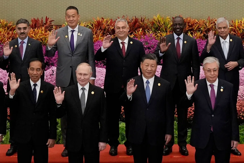 (front row, left to right) Indonesia's President Joko Widodo, Russia's President Vladimir Putin, China's President Xi Jinping, Kazakhstan's President Kassym-Jomart Tokayev with other leaders wave during a group photo at the third Belt and Road Forum for International Cooperation at the Great Hall of the People in Beijing on 18 October 2023. (Suo Takekuma/AFP)