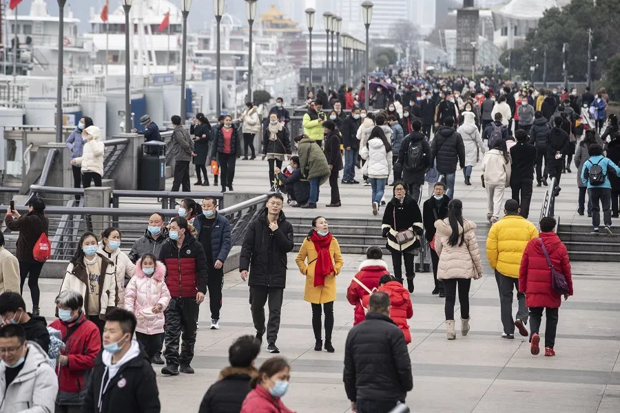 Visitors walk on the Bund in Shanghai, China, on 12 February 2021. (Qilai Shen/Bloomberg)