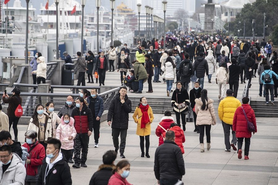 Visitors walk on the Bund in Shanghai, China, on 12 February 2021. (Qilai Shen/Bloomberg)