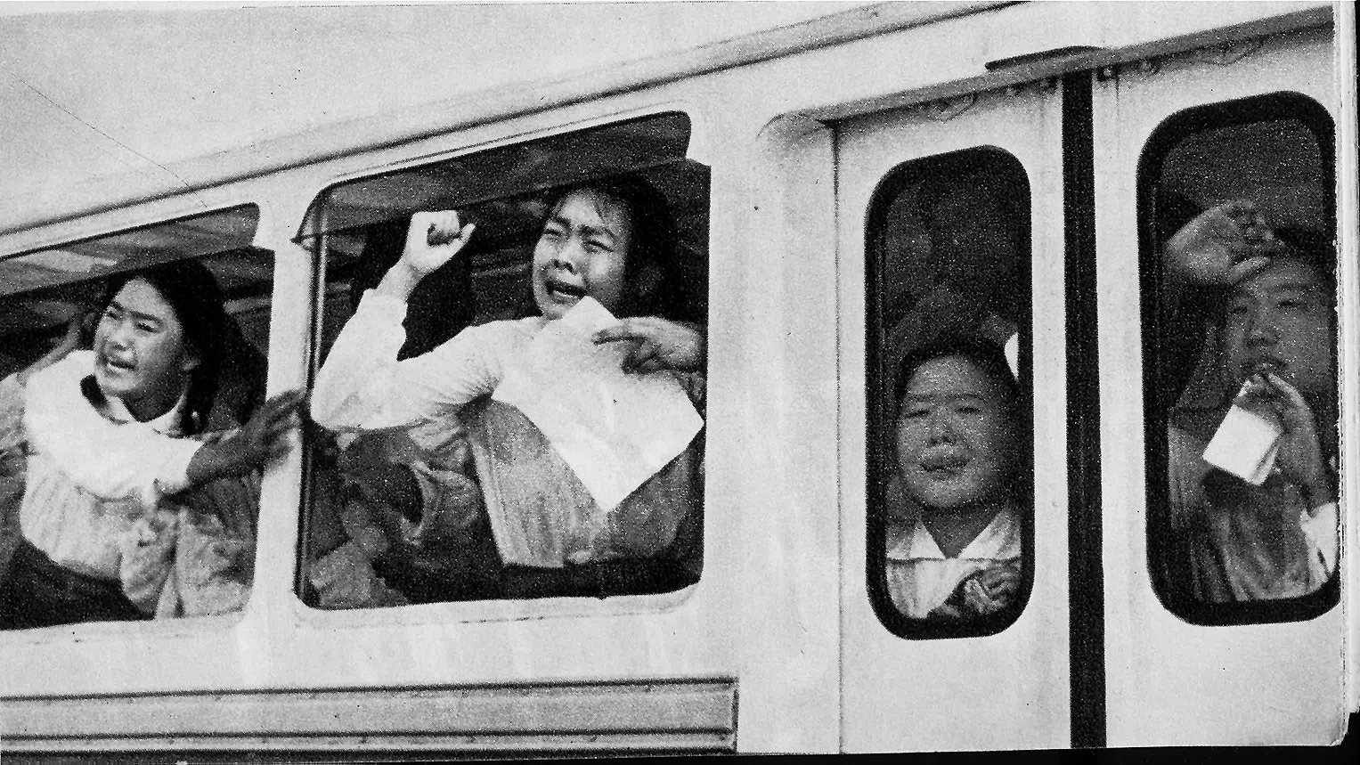 Grief-stricken passengers on a bus passing by Tiananmen Square when Mao died in September 1976.