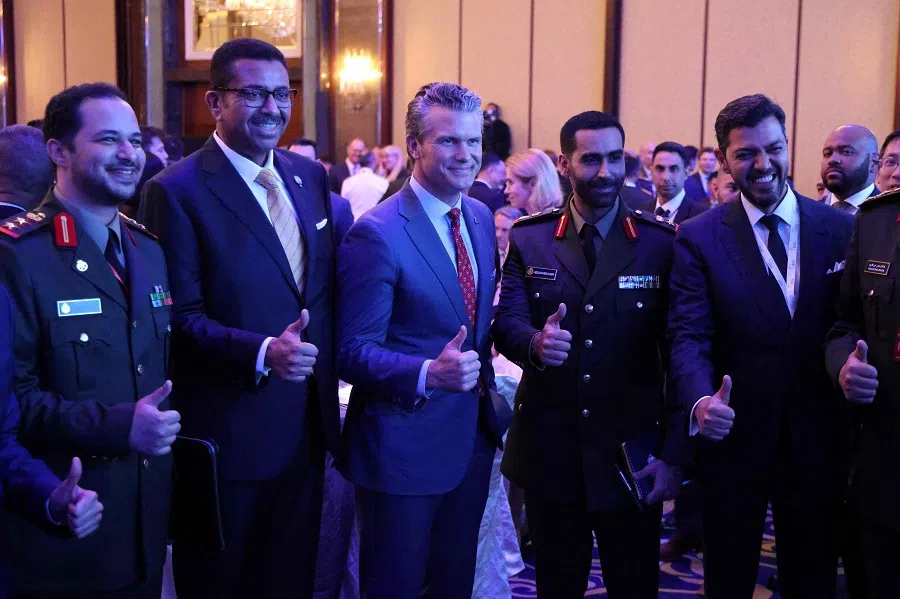 US Defence Secretary Pete Hegseth (centre) poses with military officers at the opening of the Shangri-La Dialogue Summit in Singapore on 30 May 2025. (Ludovic Marin/AFP)