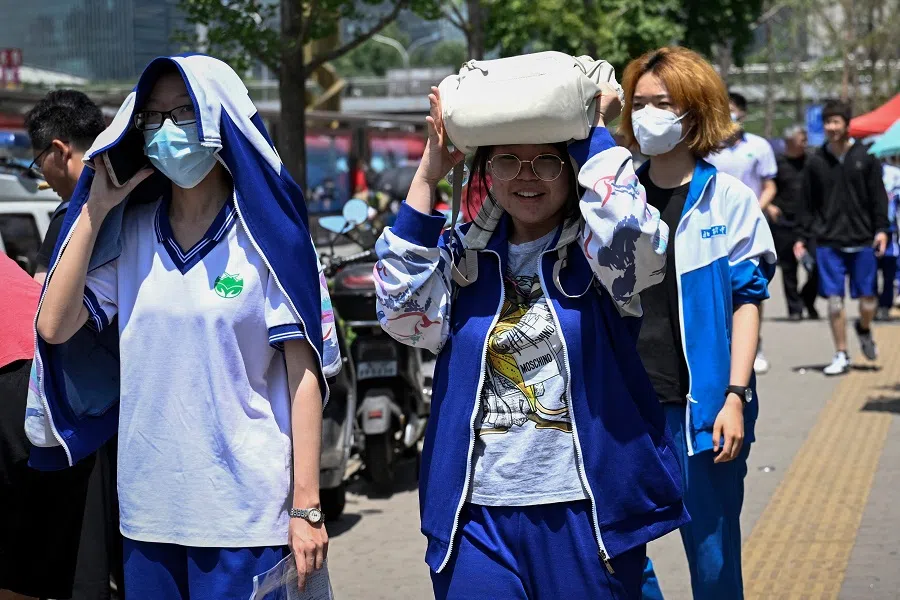 Students leave a school after finishing the exam on the first day of the National College Entrance Examination (NCEE), known as "gaokao", in Beijing, China on 7 June 2023. (Jade Gao/AFP)