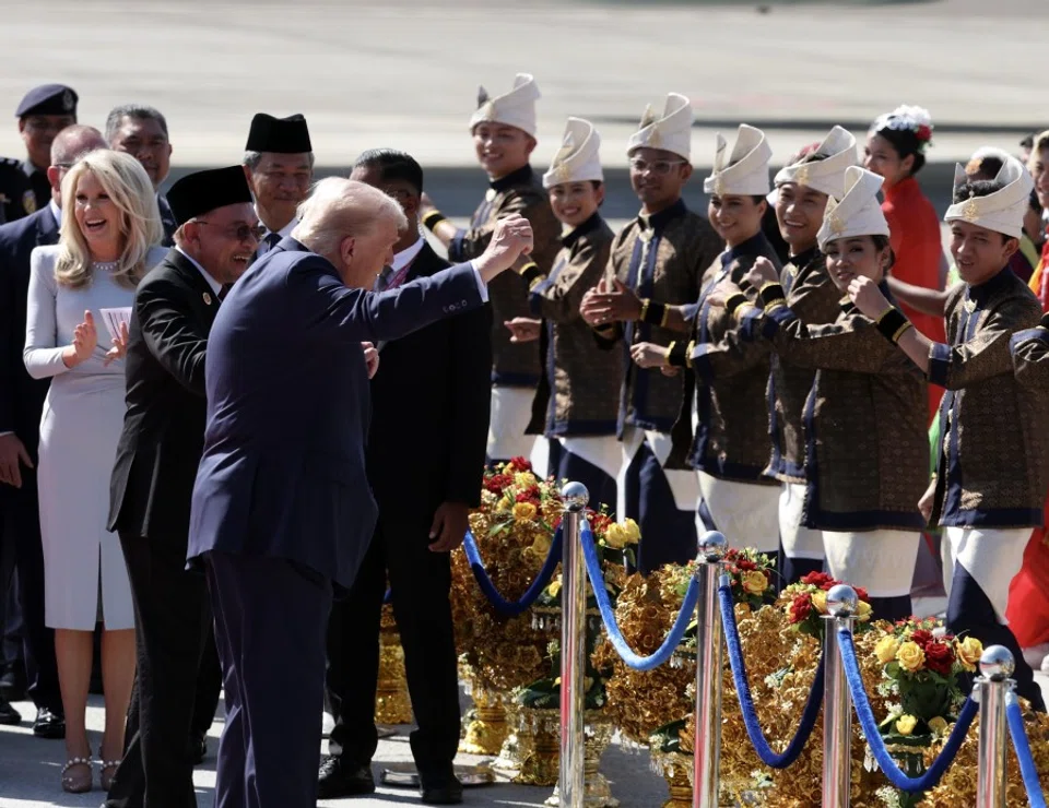 US President Donald Trump moves along with a lively troupe of traditional Malay dancers in vibrant costumes, as he arrives in Malaysia for the 47th ASEAN Summit, 26 October 2025. (FotoBernama)