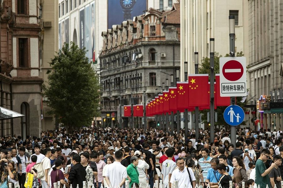 Pedestrians and shoppers on Nanjing Road shopping street in Shanghai, China, on 3 October 2023. (Bloomberg)