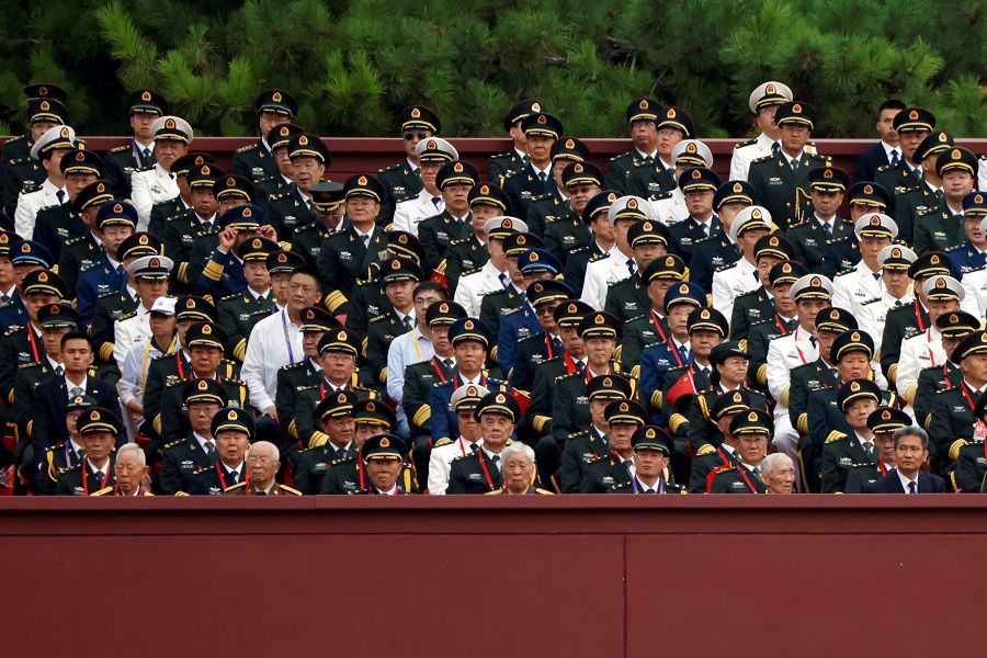 Military delegates attend the event marking the 100th founding anniversary of the Communist Party of China, on Tiananmen Square in Beijing, China, 1 July 2021. (Carlos Garcia Rawlins/File Photo/Reuters)
