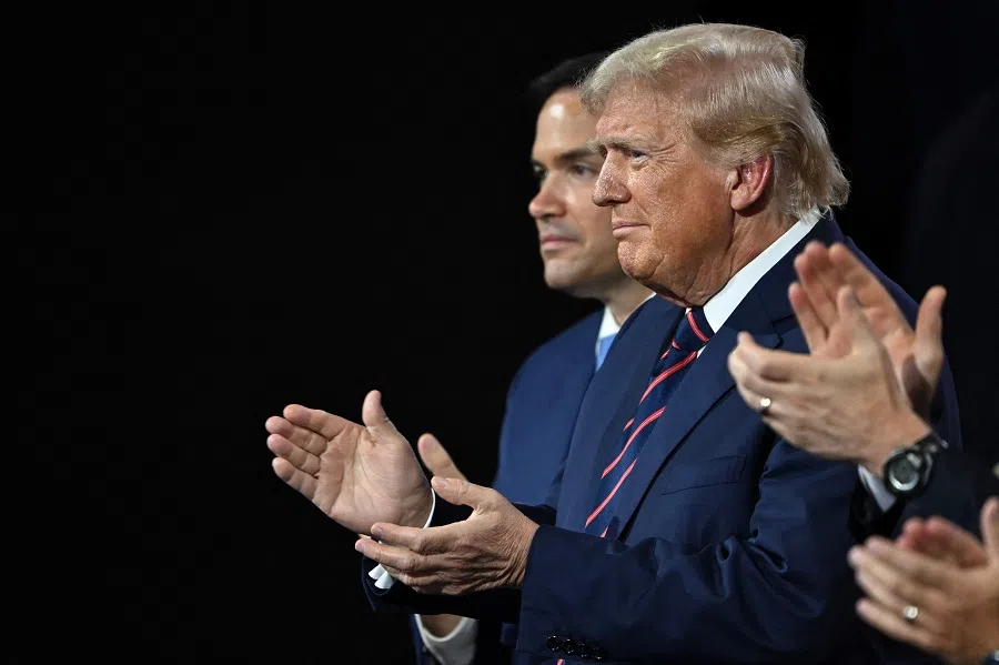 US President-elect Donald Trump, alongside Senator Marco Rubio of Florida, applauds during the third day of the 2024 Republican National Convention at the Fiserv Forum in Milwaukee, Wisconsin, on 17 July 2024.