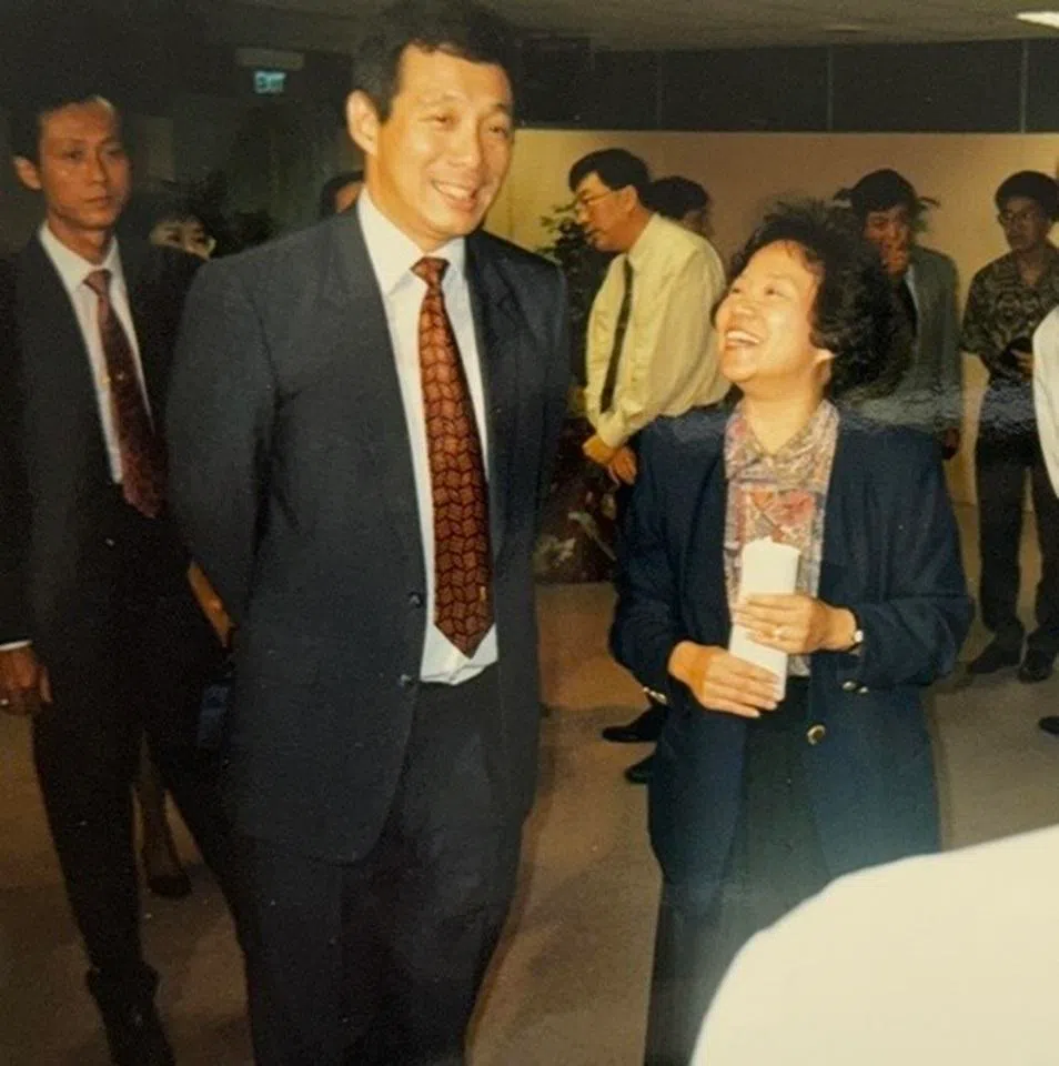 Deputy Prime Minister Lee Hsien Loong with host Zhu Liangliang at the final of the International Varsity Debate Competition, 1988.