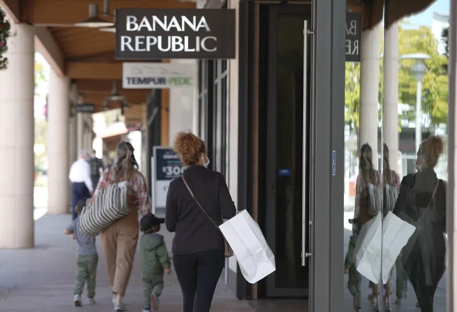 Shoppers carry bags while walking through the Village at Corte Madera on 16 September 2021 in Corte Madera, California. (Justin Sullivan/AFP)