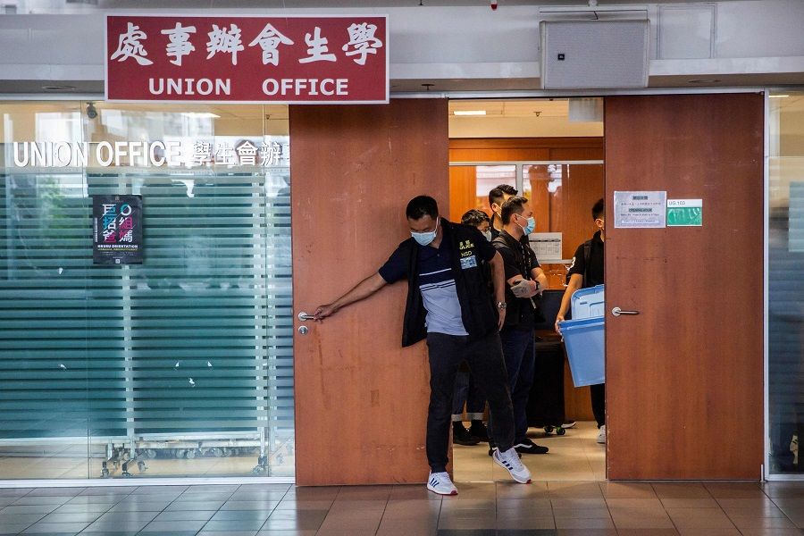 Police from the National Security Division arrive at the Hong Kong University Students' Union building to conduct a search in Hong Kong, China on 16 July 2021. (Isaac Lawrence/AFP)
