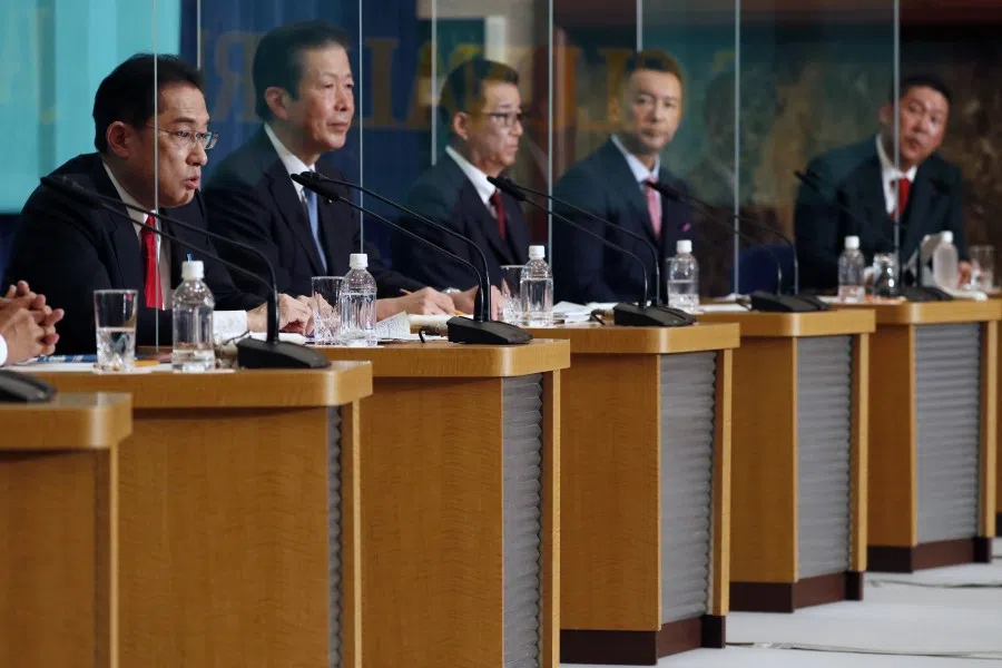 Fumio Kishida, Japan's prime minister and president of the Liberal Democratic Party (LDP), left, speaks during a party leaders' debate at the Japan National Press Club ahead of a general election in Tokyo, Japan, on 18 October 2021. (Issei Kato/Reuters/Bloomberg)