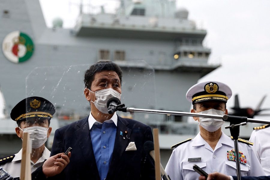 Japan's Defence Minister Nobuo Kishi speaks to members of the media after he inspected the British Royal Navy's HMS Queen Elizabeth aircraft carrier at the US naval base in Yokosuka, Kanagawa prefecture on 6 September 2021. (Kiyoshi Ota/AFP)