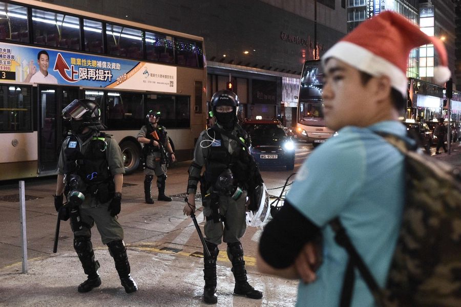 Hong Kong's Christmas celebrations were marred by sporadic clashes between police and pro-democracy activists on 25 December 2019 as the city's pro-Beijing leader said the festive season was being "ruined" by demonstrators. (Philip Fong/AFP)