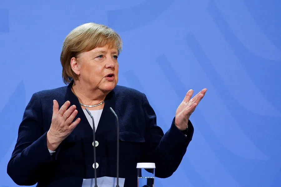 Former German Chancellor Angela Merkel speaks as she hands over the chancellery to her successor, newly appointed German Chancellor Olaf Scholz at the Chancellery in Berlin, Germany, 8 December 2021. (Fabrizio Bensch/File Photo/Reuters)