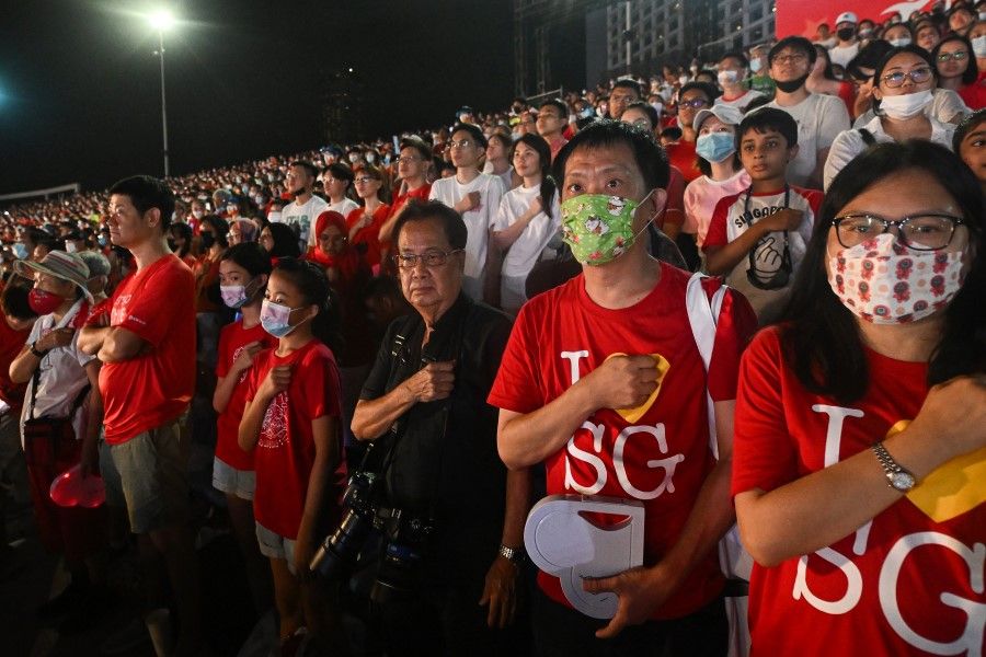 Spectators taking the pledge during NDP 2022 Preview 1 show held at The Float @ Marina Bay on 23 July 2022. (SPH Media)