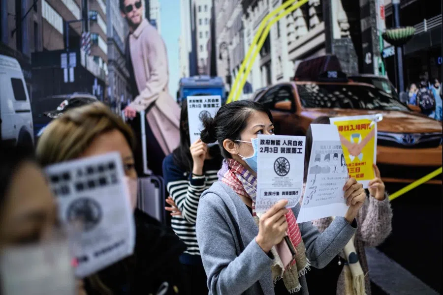 Protesters demanding the Hong Kong government close its border with mainland China to reduce the spread of the Wuhan coronavirus to Hong Kong, February 3, 2020. Hundreds of Hong Kong medical workers walked off their jobs on February 3, demanding the city close its border with China to reduce the coronavirus spreading, with frontline staff threatening to follow suit in the coming days. (Anthony Wallace/AFP)