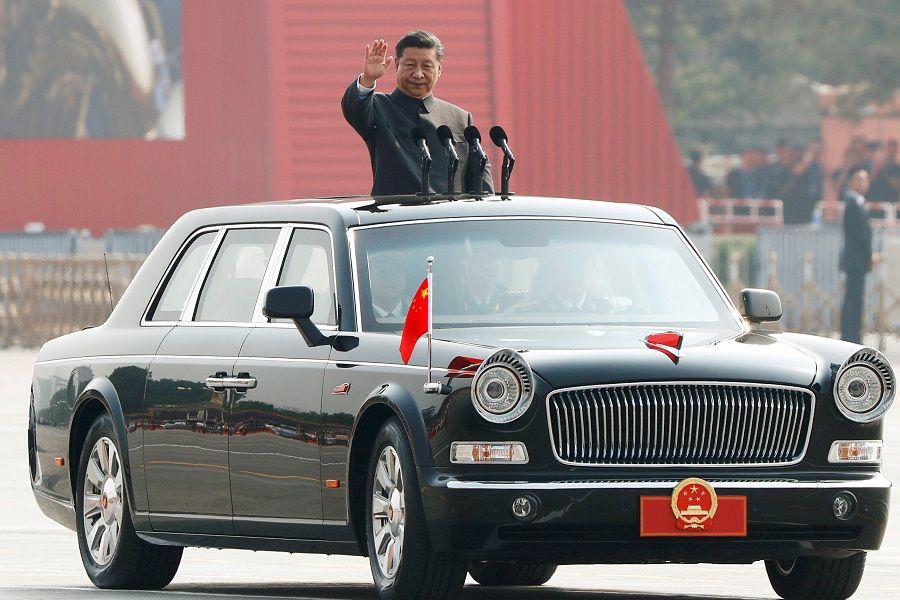 Chinese President Xi Jinping waves as he reviews the troops at a military parade marking the 70th anniversary of the People's Republic of China. (Thomas Peter/Reuters)