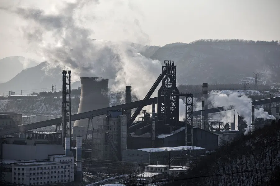 Water vapour and smoke rise from a Tonghua Iron & Steel Group Co. plant in the Erdaojiang district in Tonghua, Jilin province, China, on 6 January 2016.