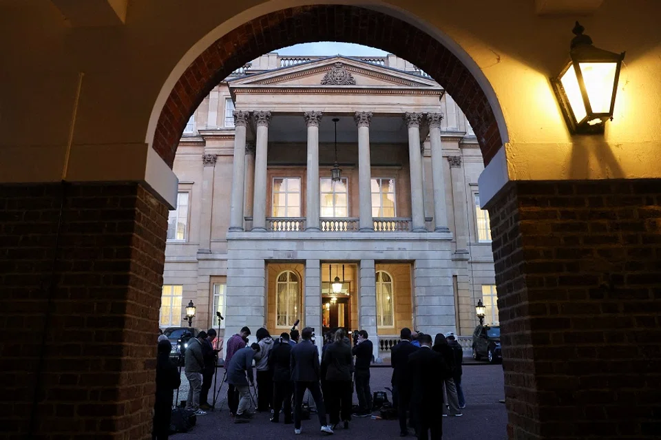 Members of the media gather outside Lancaster House, on the second day scheduled for trade talks between the US and China, in London, Britain, on 10 June 2025. (Toby Melville/Reuters)
