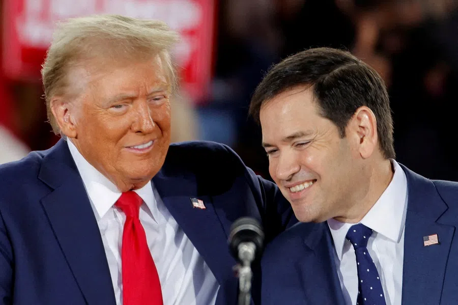US President Donald Trump and Senator Marco Rubio react during a campaign event at Dorton Arena, in Raleigh, North Carolina, US, on 4 November 2024. (Jonathan Drake/Reuters)
