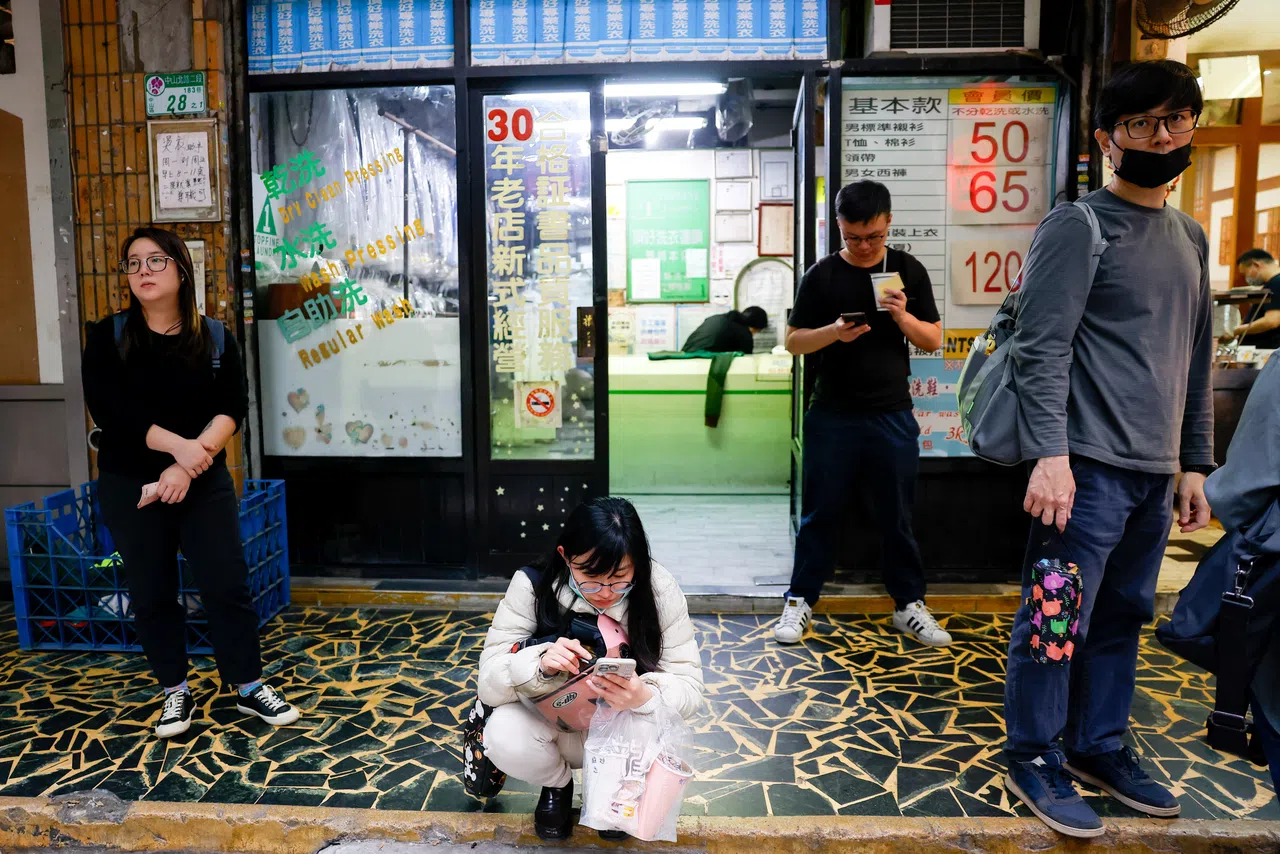 People wait to eat at a restaurant in Taipei, Taiwan, on 8 April 2025. (Ann Wang/Reuters)