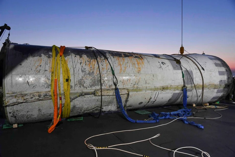 A handout picture shows a part of what is believed to be a space launch vehicle that North Korea said crashed into the sea off the west coast of the divided peninsula, and which the South Korean military had salvaged, at an unidentified location in South Korea, 15 June 2023. (The Defense Ministry/Handout via Reuters)