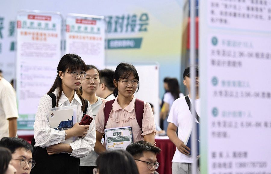 Visitors at a job fair for university graduates in Hefei, Anhui province, China, on 4 September 2023. (China Daily via Reuters)