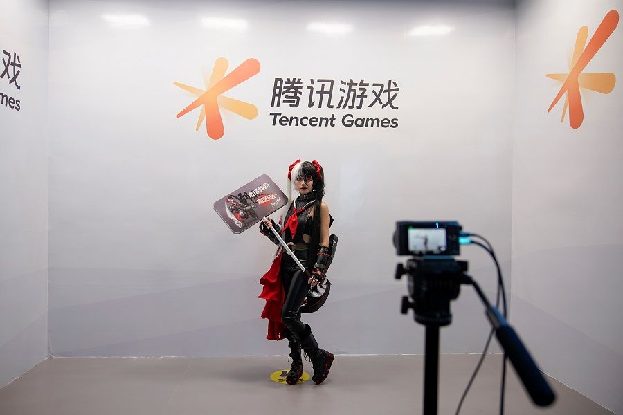 A cosplay fan poses for a photo at a Tencent Games booth during the China Digital Entertainment Expo and Conference, also known as ChinaJoy, in Shanghai, China, 30 July 2021. (Aly Song/File Photo/Reuters)