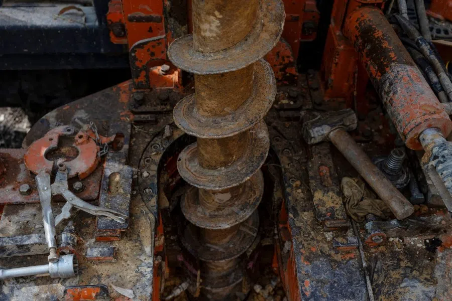 Workers drill for soil samples at a Meteoric Resources rare earth exploration project in Caldas Novas, Minas Gerais state, Brazil, on 8 July 2025. (Victor Moriyama/Bloomberg)