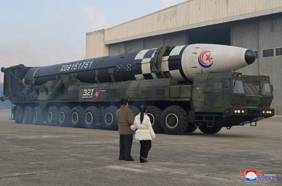 North Korean leader Kim Jong-un and his daughter inspect an intercontinental ballistic missile (ICBM) in this undated photo released on 19 November 2022 by North Korea's Korean Central News Agency (KCNA). (KCNA via Reuters)