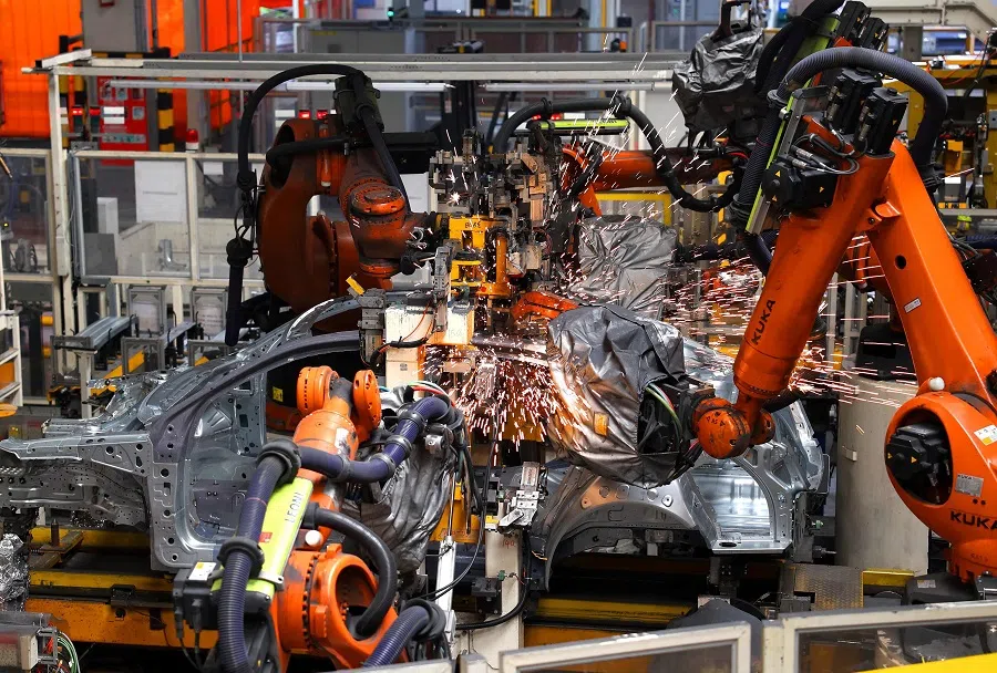 Robots carry out welding operations in the body shop of the FAW-Volkswagen production based in Jimo district, Qingdao, eastern China’s Shandong province on 19 February 2025. (AFP)