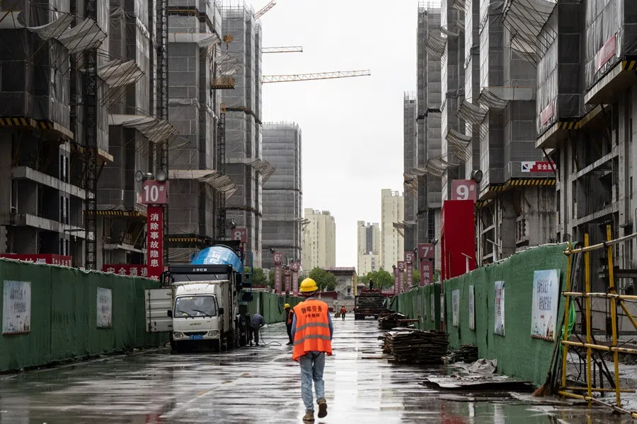 Construction workers at a large residential complex development site in Shanghai, China, on 12 July 2025. (Qilai Shen/Bloomberg)