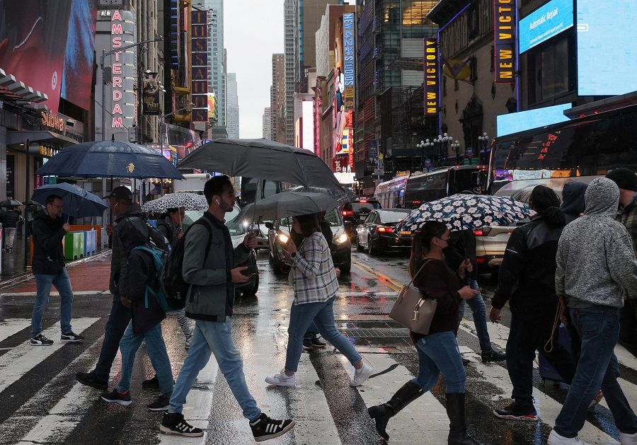 People walk through Times Square in New York City, US, on 29 September 2023. (Andrew Kelly/Reuters)