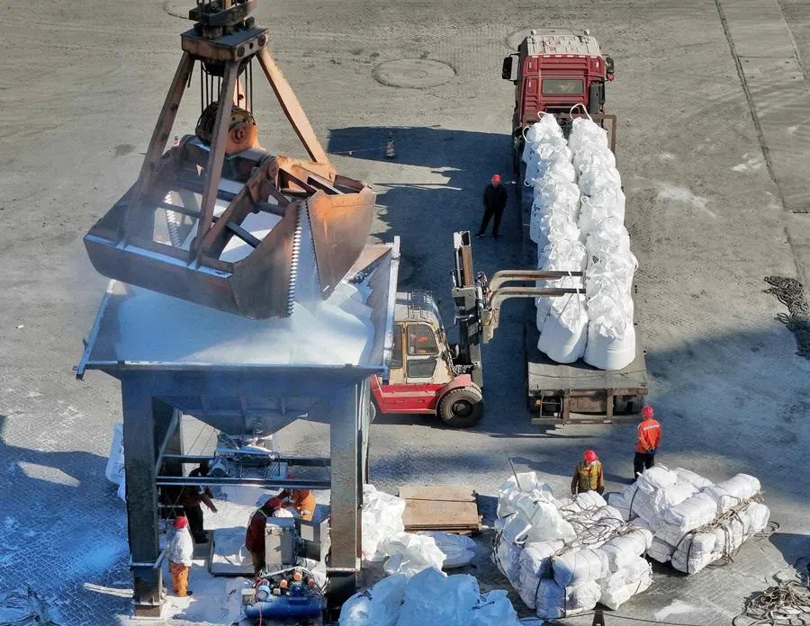 Fertiliser is unloaded from a ship at the port in Lianyungang, in China’s eastern Jiangsu province on 7 April 2026.