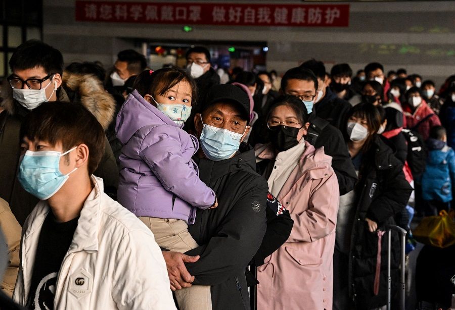 Passengers queue up at Beijing West railway station ahead of the Lunar New Year in Beijing, China, on 21 January 2023. (Noel Celis/AFP)