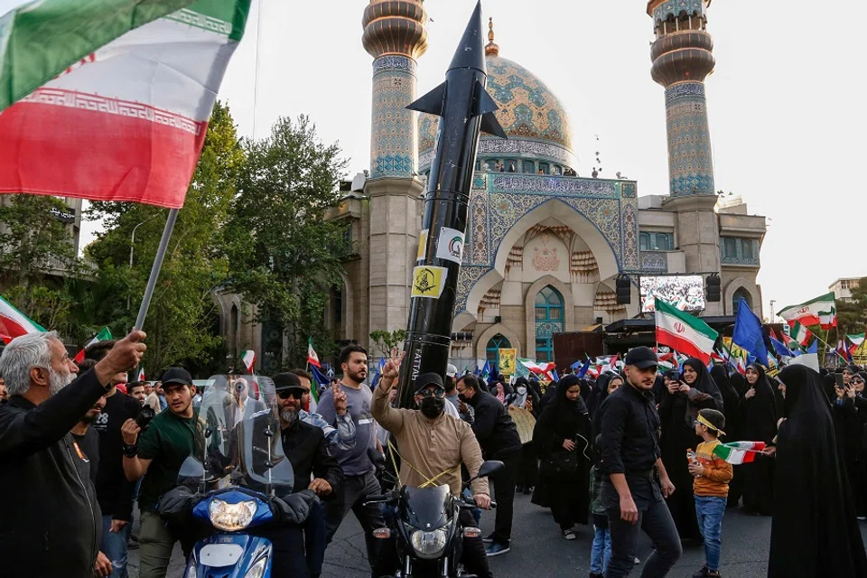 Iranians celebrate following Iran's missiles and drones attack on Israel, on 15 April 2024, at Palestine square in central Tehran, Iran. (Atta Kenare/AFP)