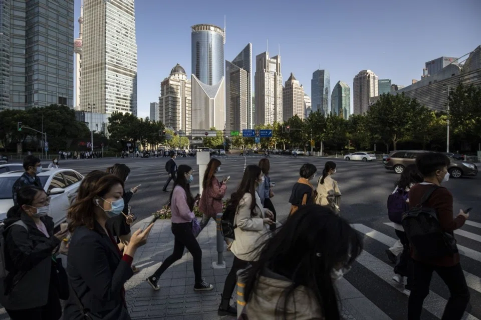 Pedestrians in the Pudong's Lujiazui Financial District in Shanghai, China, on 10 October 2022. (Qilai Shen/Bloomberg)