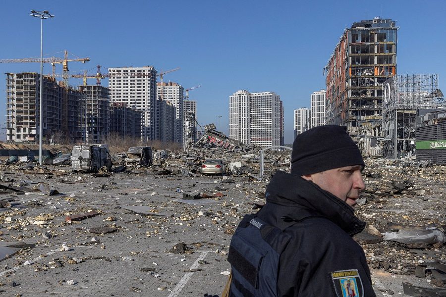 Ukrainian serviceman secures the site of a bombing at a shopping centre as Russia's invasion of Ukraine continues, in Kyiv, Ukraine, 21 March 2022. (Marko Djurica/File Photo/Reuters)