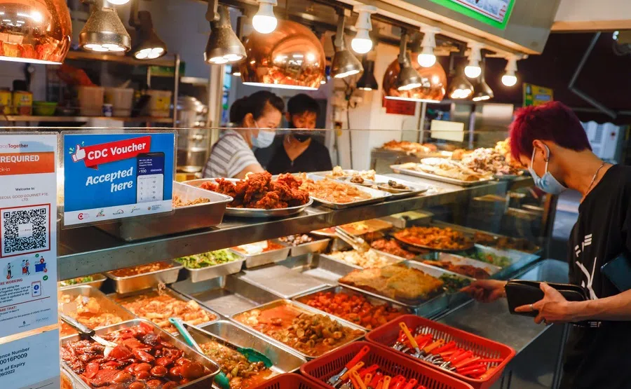 People buying food from a cai fan stall in Singapore. (SPH Media)