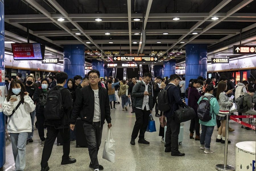 Commuters in the subway station at Zhujiang New Town in Guangzhou, China, on 16 November 2023. (Qilai Shen/Bloomberg)