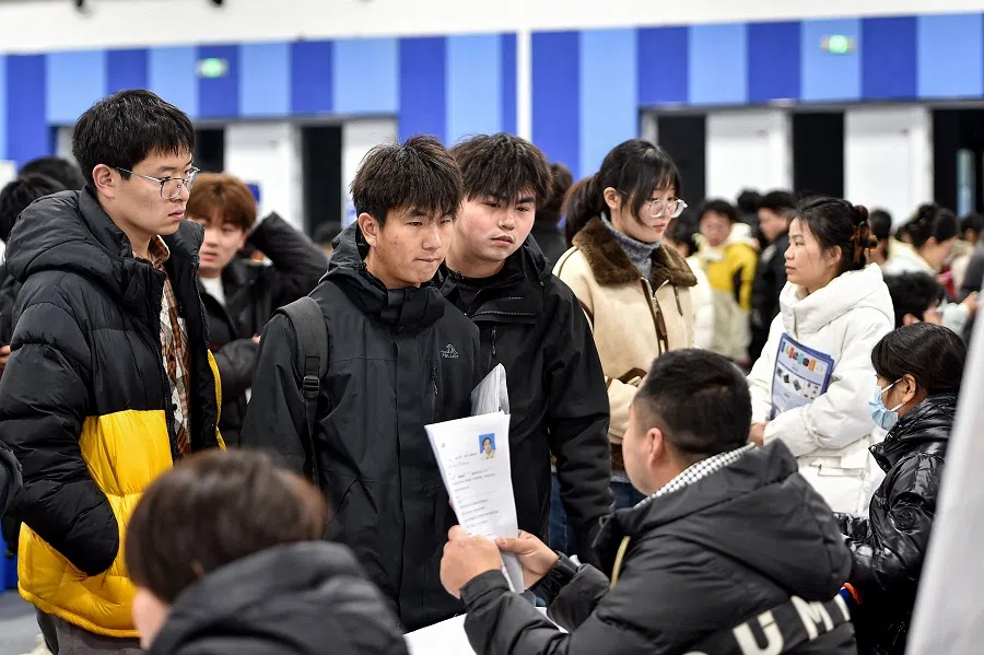 Students attend a job fair at a vocational and technical school in Hefei, in eastern China’s Anhui province on 3 March 2025. (AFP)