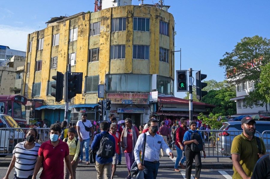 In this photograph taken on 21 July 2023, a yellow-painted building is pictured at the commercial hub of Pettah in Colombo. (Ishara S. Kodikara/AFP)