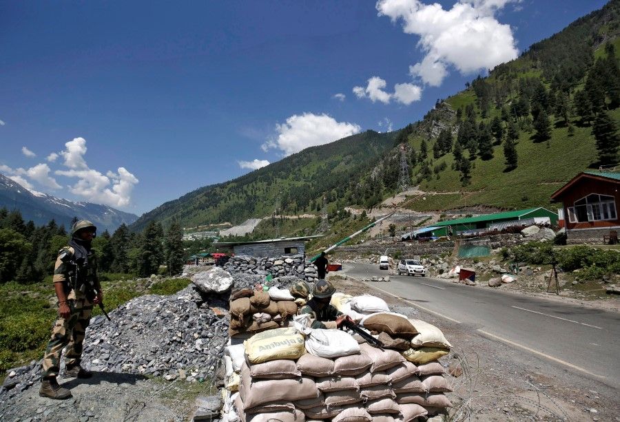 India's Border Security Force (BSF) soldiers stand guard at a checkpoint along a highway leading to Ladakh, at Gagangeer in Kashmir's Ganderbal district 17 June 2020. (Danish Ismail/REUTERS)