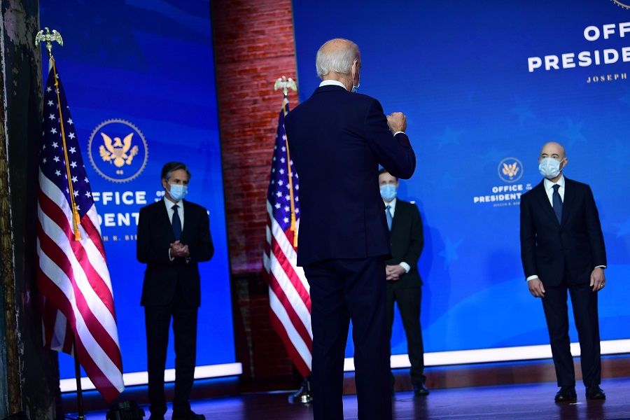 President-elect Joe Biden gestures to key foreign policy and national security nominees and appointments at the Queen Theatre on 24 November 2020 in Wilmington, Delaware. (Mark Makela/Getty Images/AFP)
