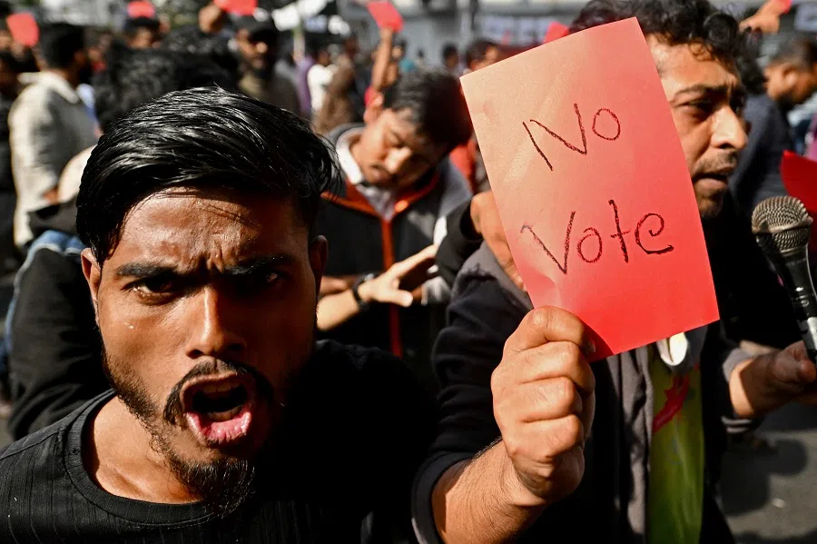 People take part in a rally organised by Gonotontro Moncho, an alliance of political parties, to protest against the upcoming 2024 general elections in Dhaka, Bangladesh, on 30 December 2023. (Munir Uz Zaman/AFP)