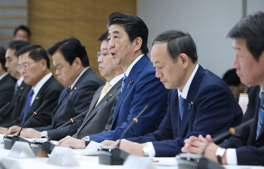 Japan's Prime Minister Shinzo Abe (C) speaks during a meeting at the new COVID-19 coronavirus infectious disease control headquarters at the prime minister's office in Tokyo on February 27, 2020. ( Jiji Press/AFP)