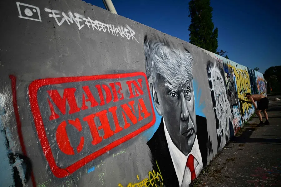 A mural by Berlin-based graffitti artist Eme Freethinker of US President Donald Trump and the lettering reading ‘Made in China’ is pictured on a wall at the Mauerpark public park in Berlin, Germany, on 26 April 2025.