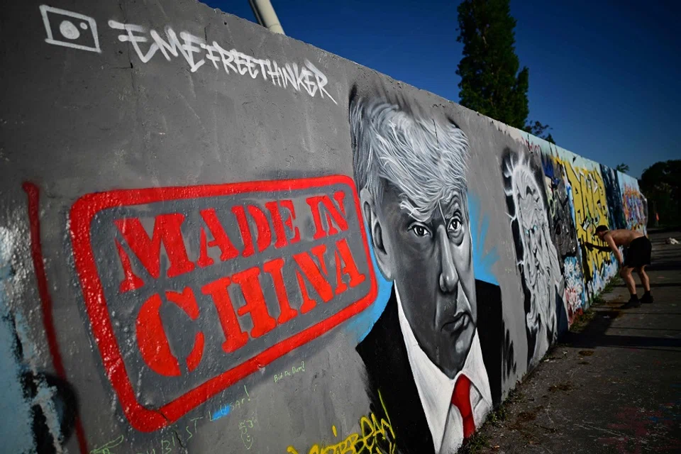 A mural by Berlin-based graffitti artist Eme Freethinker of US President Donald Trump and the lettering reading ‘Made in China’ is pictured on a wall at the Mauerpark public park in Berlin, Germany, on 26 April 2025. (Tobias Schwarz/AFP)