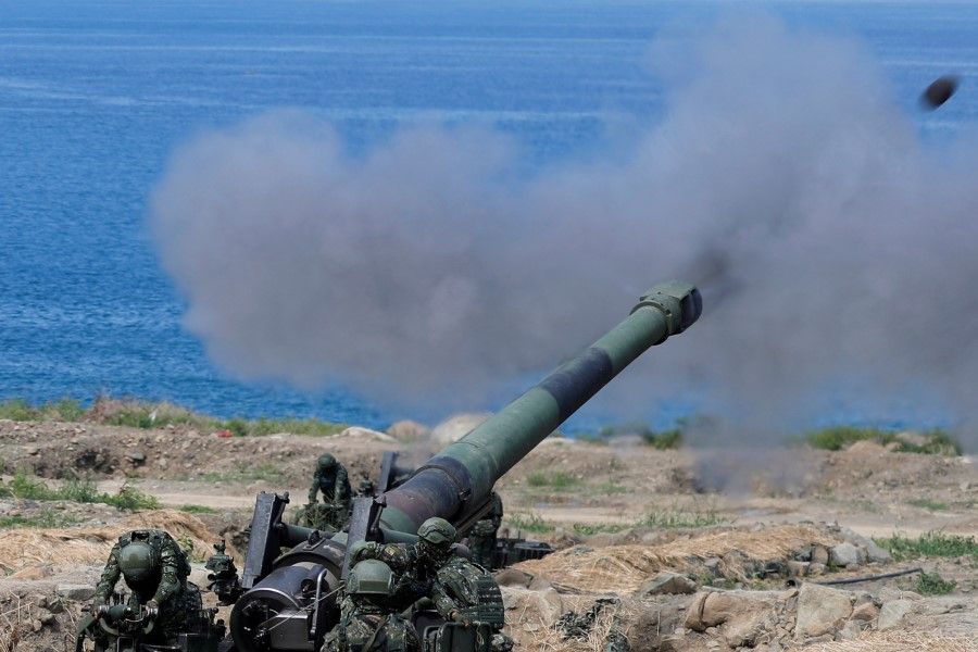 Soldiers fire an 8-inch (203 mm) M110 self-propelled howitzer during the live fire Han Kuang military exercise, which simulates China's People's Liberation Army (PLA) invading the island, in Pingtung, Taiwan, 30 May 2019. (Tyrone Siu/Reuters)