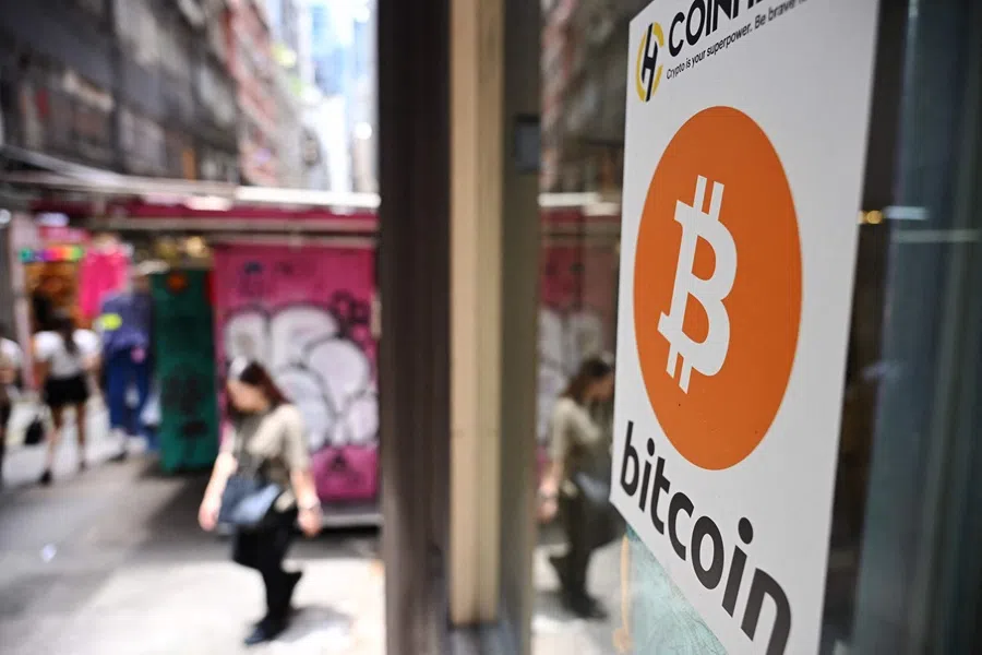 A Bitcoin sign is seen at a cryptocurrency exchange in Hong Kong on 11 July 2025. (Peter Parks/AFP)